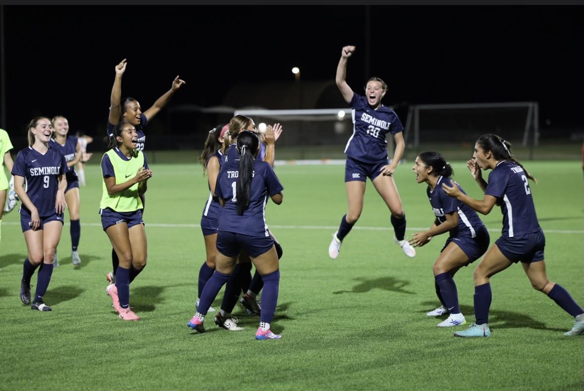 The Trojans celebrate recent Region 2 road win.